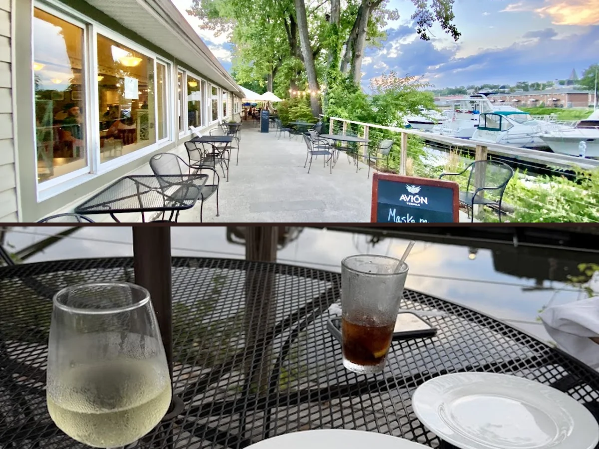 Patio seating beside a creek view.
